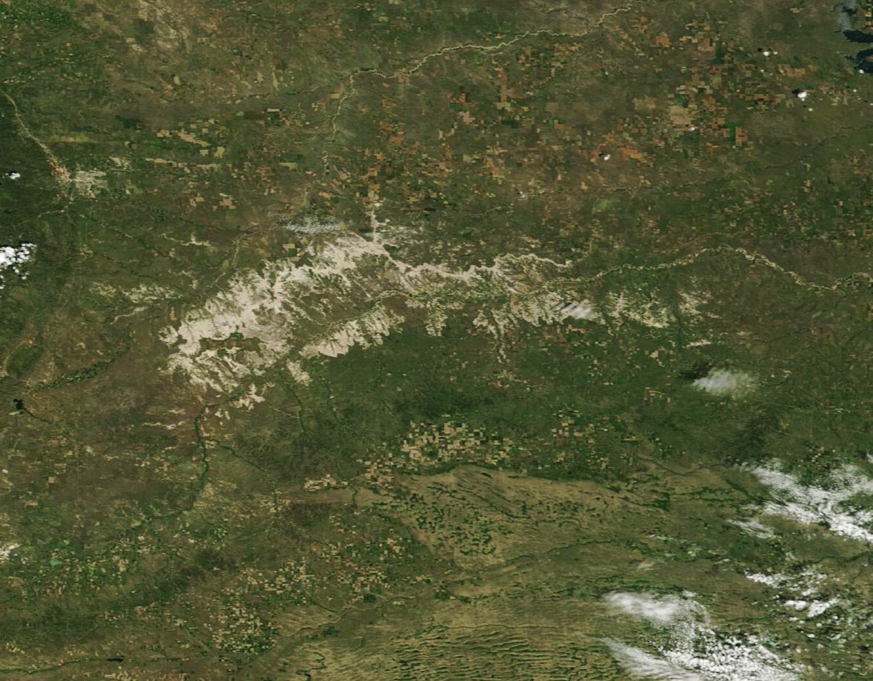 The U.S. National Park Service calls Badlands National Park the “Land of Stone and Light” —a moniker that truly seems to fit, even when the rugged refuge is viewed from space