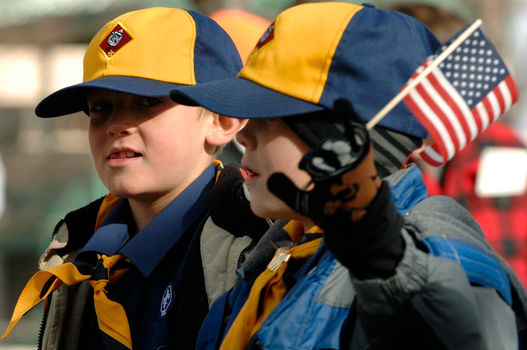 Members of the Cub Scouts Pack 74 march in their hometown during a parade in downtown Rapid City, S.D., Nov