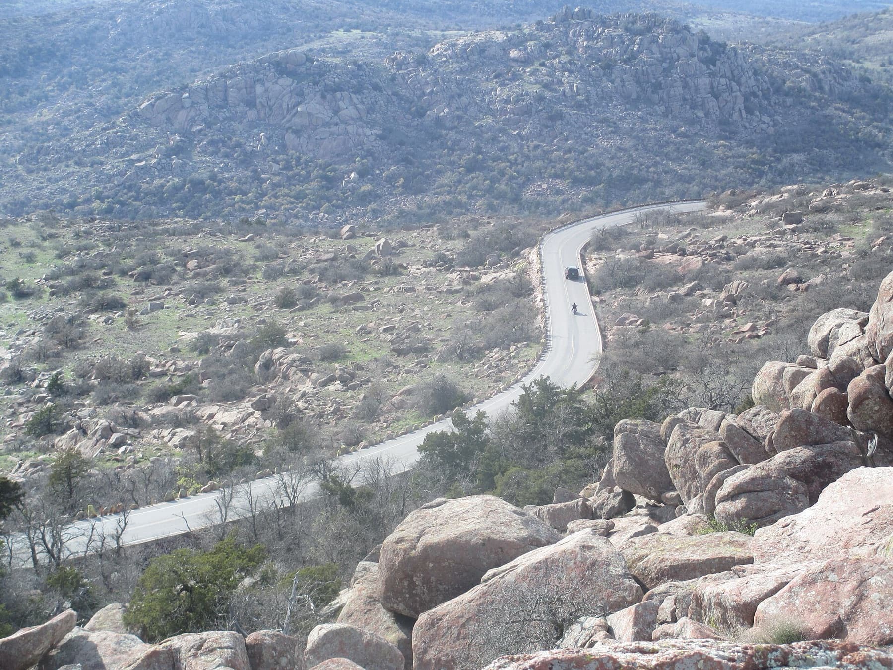 I took photo with Canon camera of winding roadway from the top of Mount Scott in Oklahoma