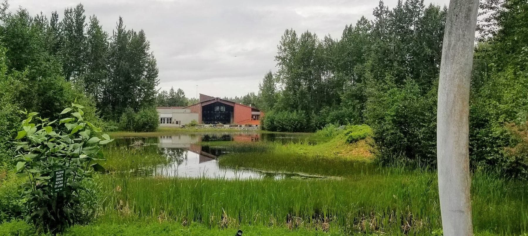 The Alaska Native Heritage Center as seen from across Lake Tiulana