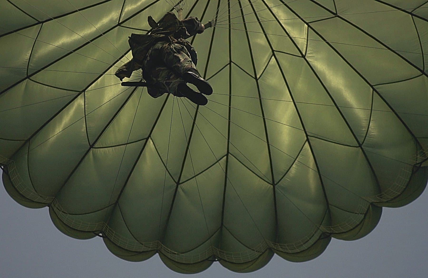 A member of the Army's 82nd Airborne Division Fort Bragg, North Carolina, parachutes to the ground at Charleston Air Force Base after jumping from a C-17 Globemaster III, 15th Airl