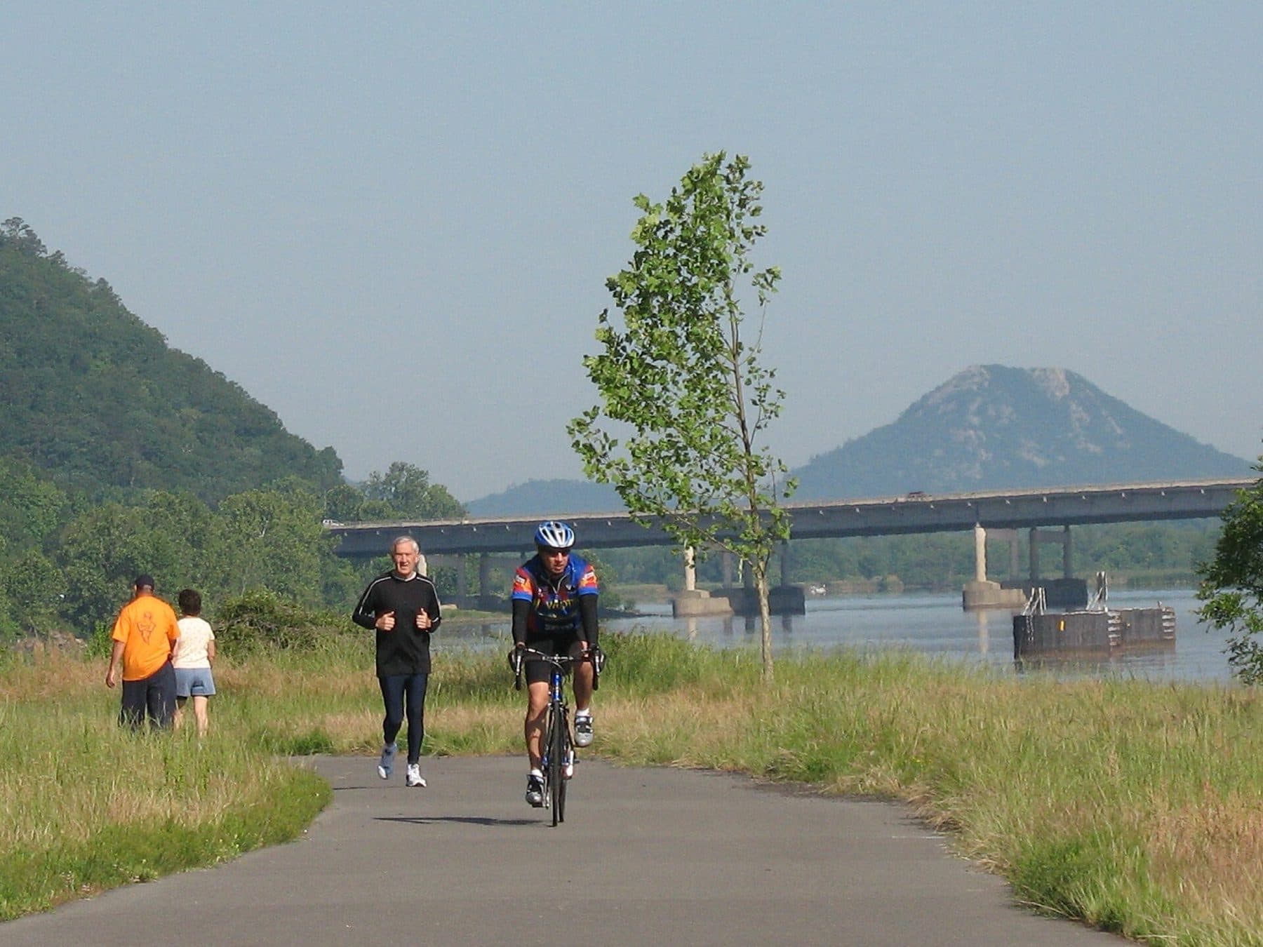 Arkansas River Trail — users enjoying the western portion of the trail with Pinnacle Mountain in the background, in central Arkansas.