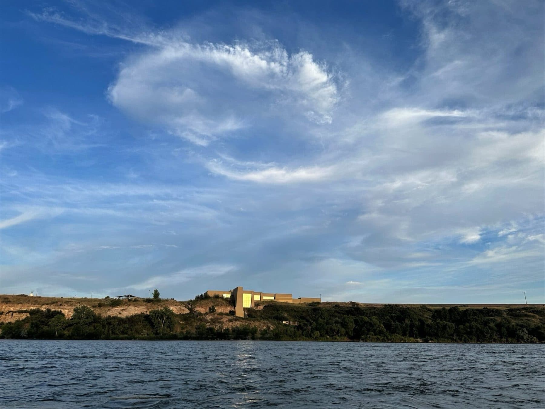 The Lewis and Clark Interpretive Center (Managed by the Helena-Lewis and Clark National Forest) stands over the Missouri River in Great Falls Montana near sunset on July 16, 2023