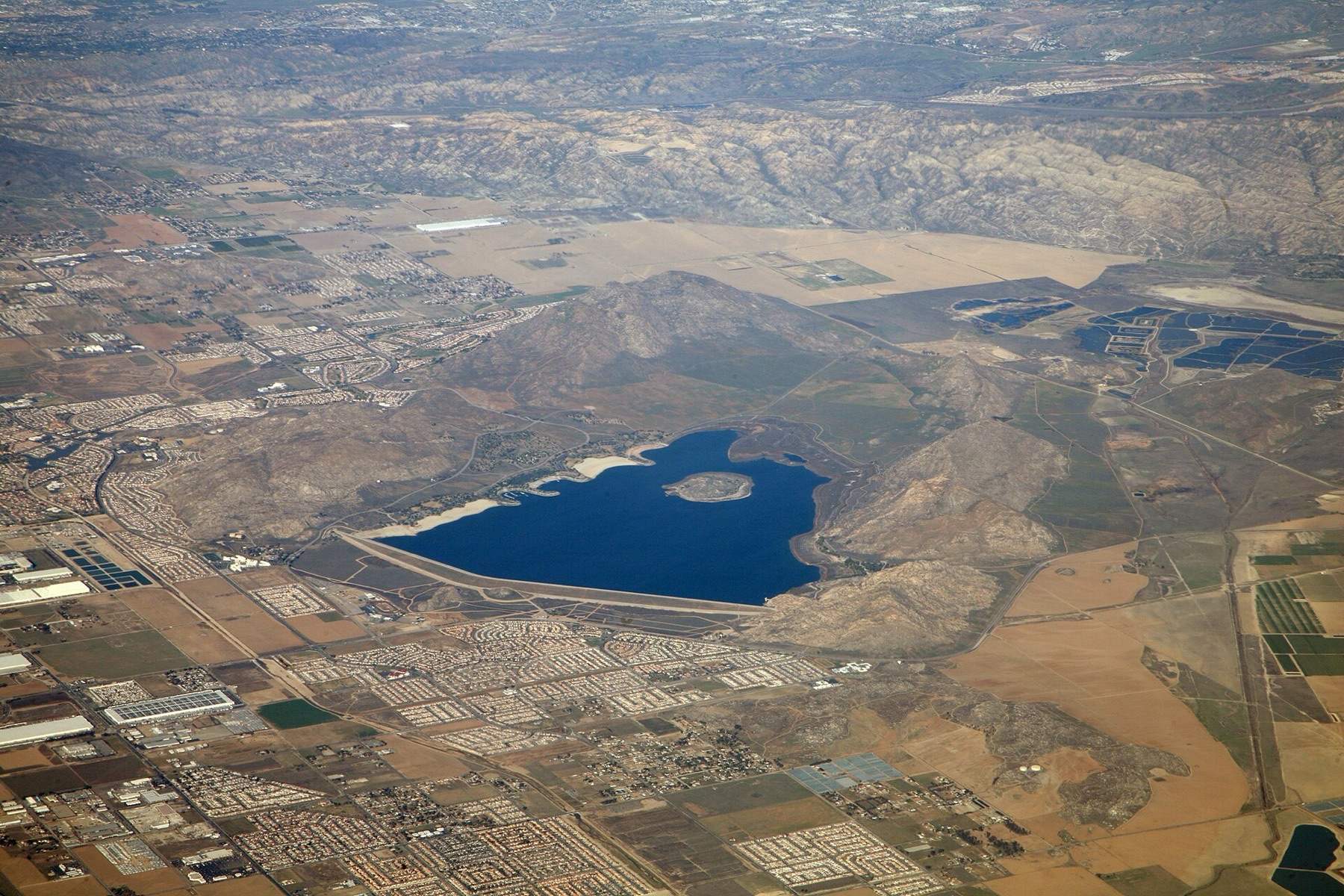 Aerial view from a passenger jet of Lake Perris State Recreation Area — surrounding Lake Perris, in Riverside County, California