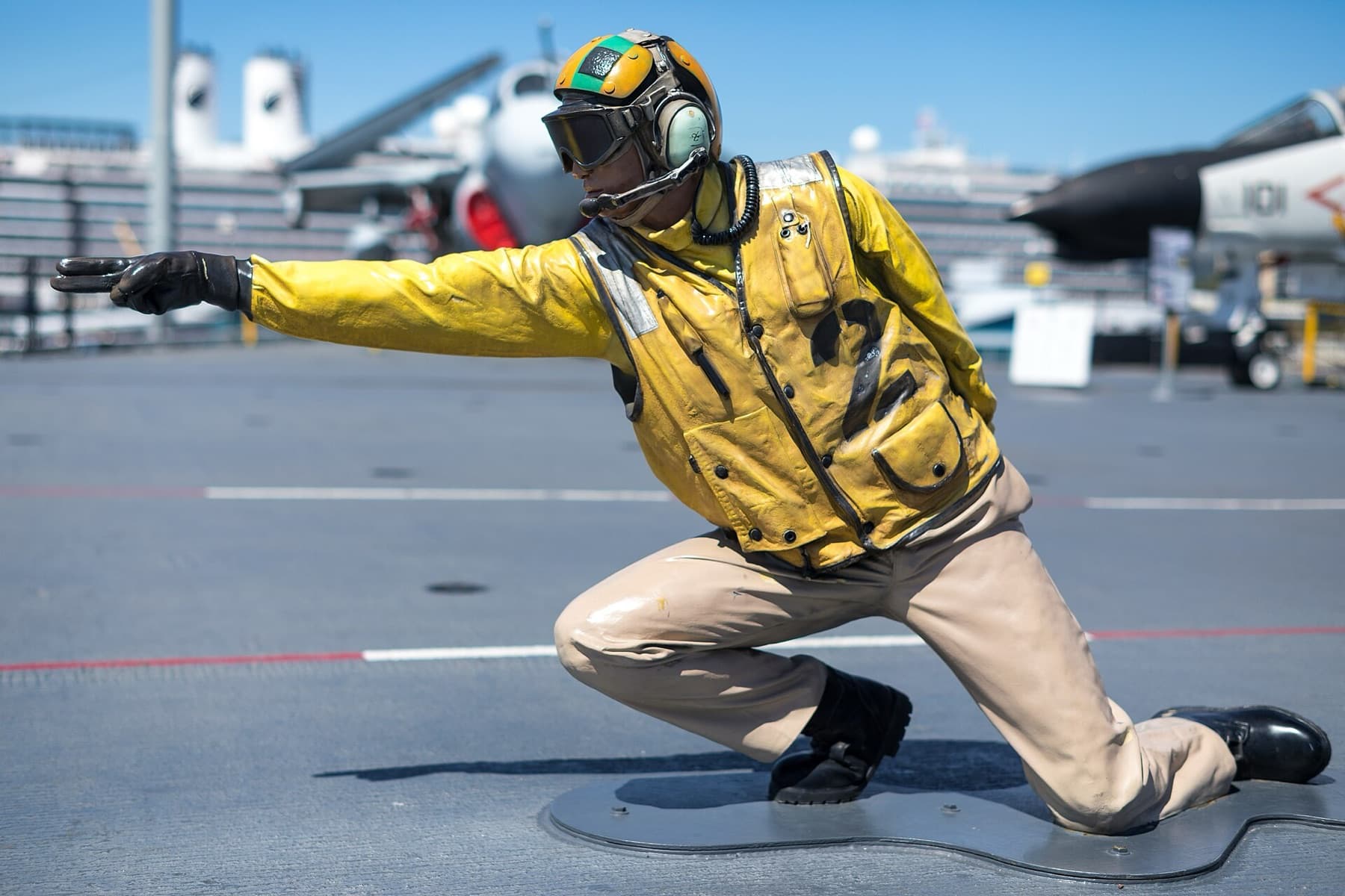 Mannequin depicting a flight deck officer launching an aircraft on the flight deck of the USS Midway, USS Midway Museum, San Diego, California