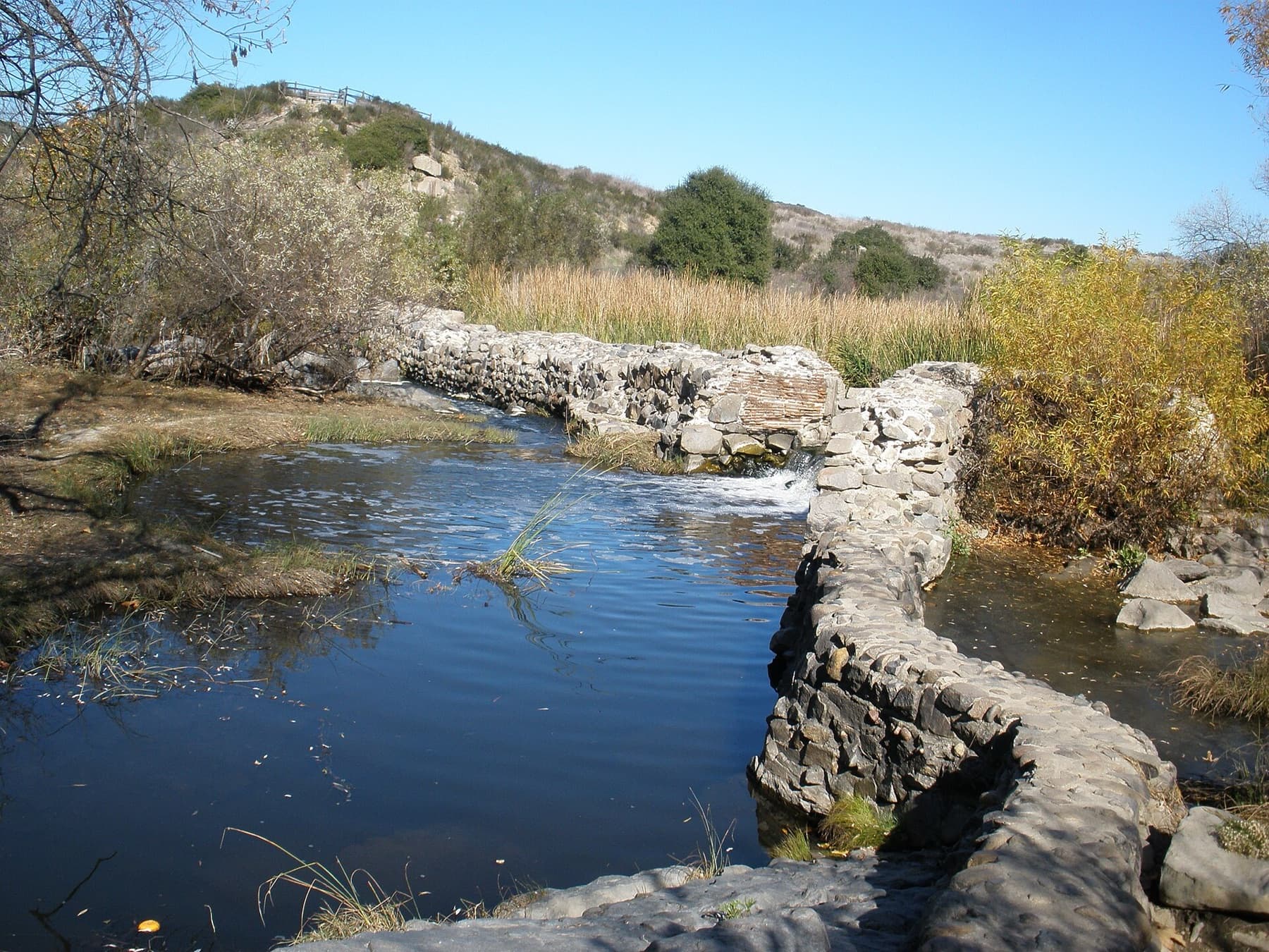 Old Mission Dam, also called Padre Dam, was built about 200 years ago by the Kumeyaay Indians under the direction of the missionaries at Mission San Diego de Alcala