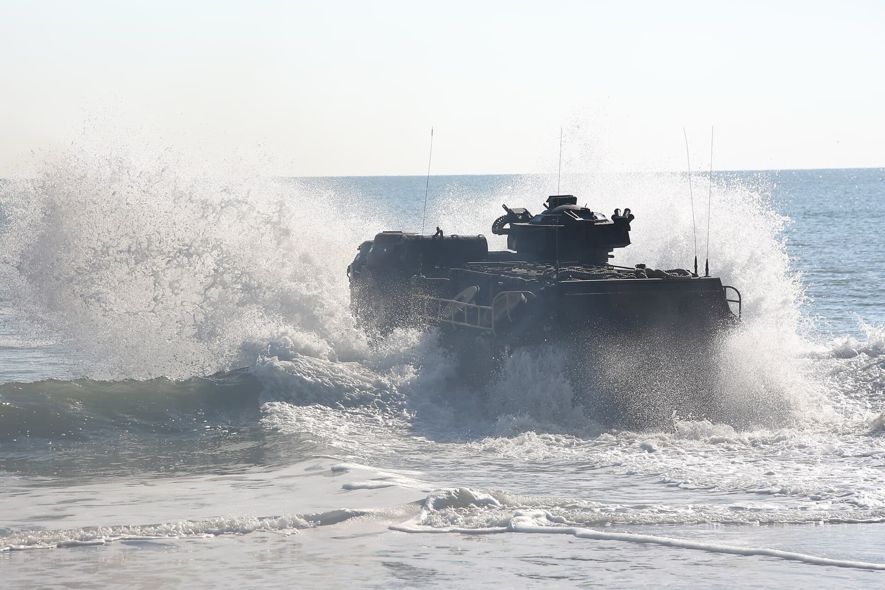 Marines with Amphibious Assault Vehicle (AAV) Platoon, Company B, Ground Combat Element Integrated Task Force, drive their AAV into the Atlantic Ocean from Onslow Beach, Marine Cor