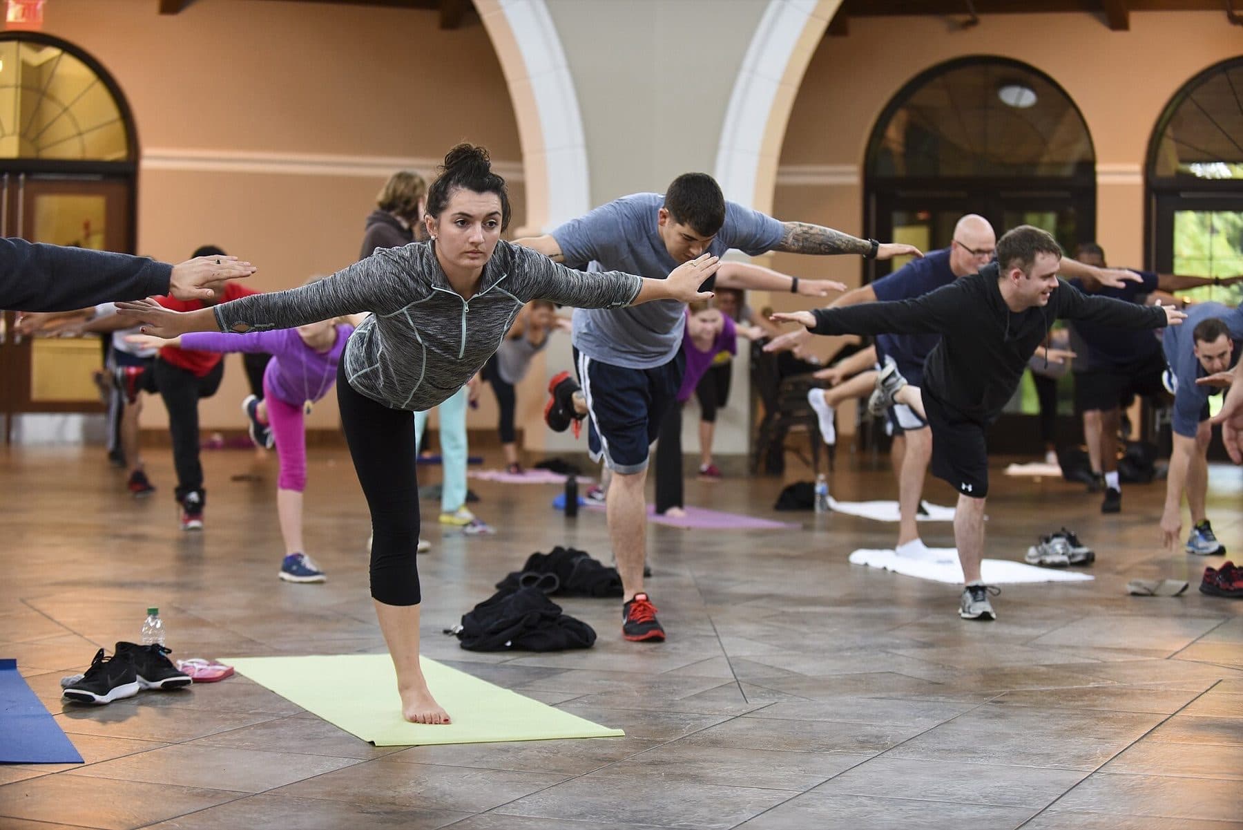 Brianne McMahon participates in yoga exercises during the USO of North Carolina Warrior Reset retreat, Nov