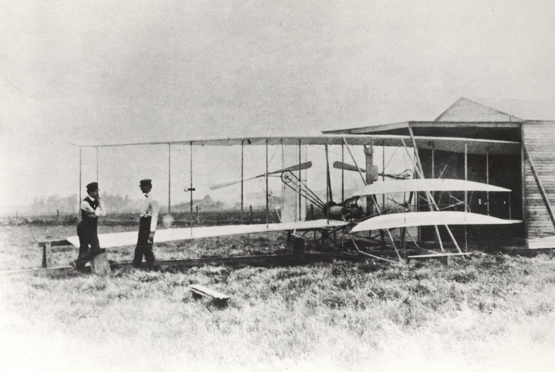 Wilbur and Orville Wright with the Flyer II at Huffman Prairie, outside of Dayton, Ohio, in May 1904